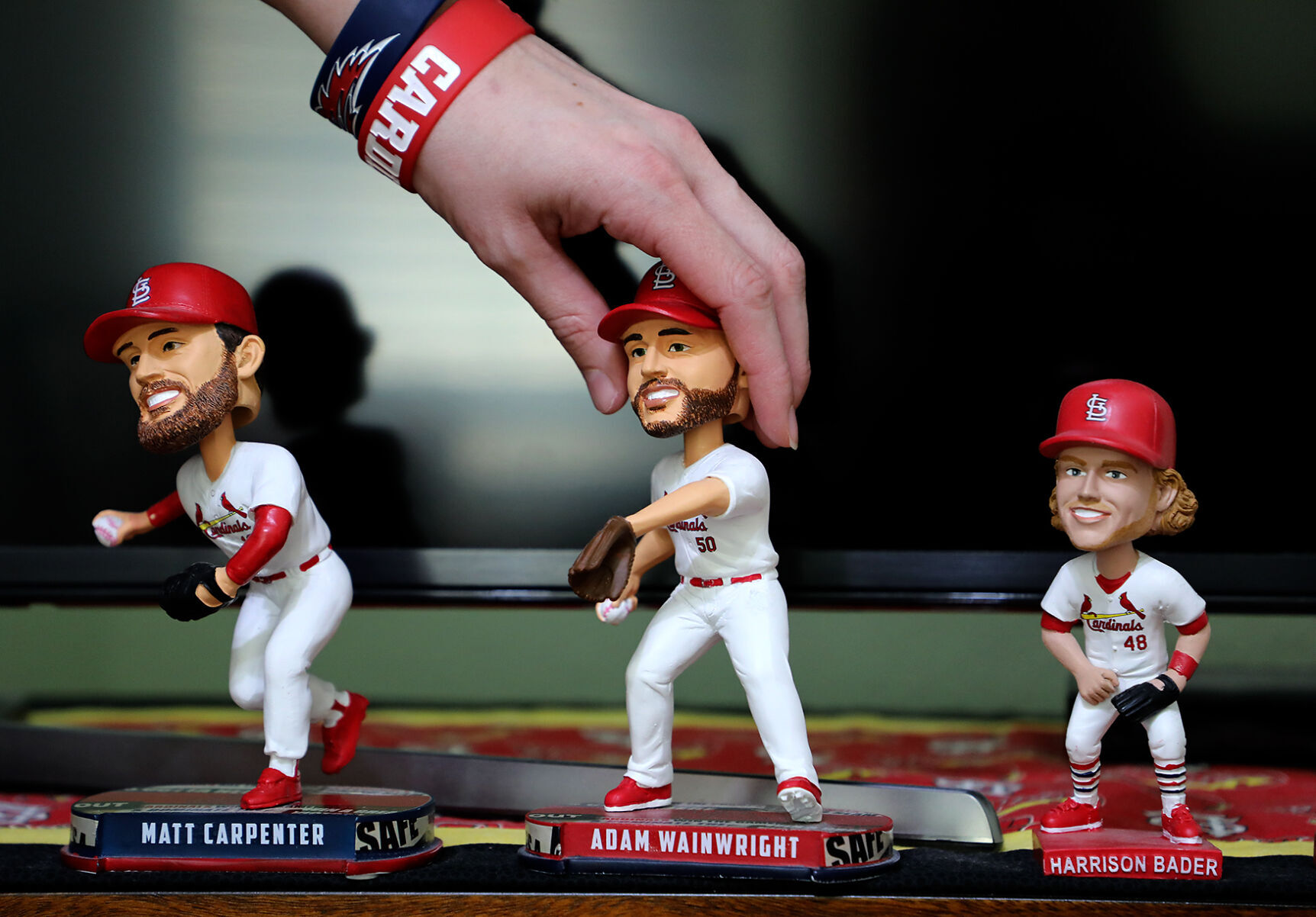Tatia Leyden grabs her Adam Wainwright bobblehead